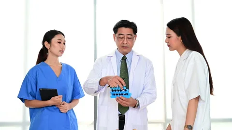 Group of doctors brainstorm meeting with computer laptop at the hospital. Stock-Footage 142852679