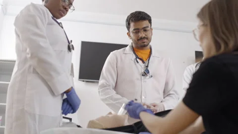 Group of doctors discussing first aid procedures Stock Footage 270175606