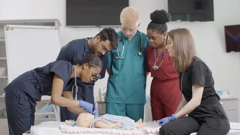 Group of doctors examining baby dummy in medical clinic Video stock 272225858