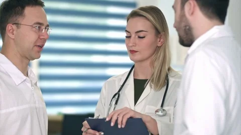Group of doctors having medical discussion Stock Footage