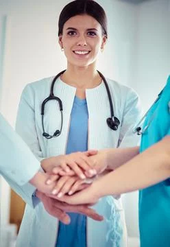Group of doctors putting their hands together Stock Photos