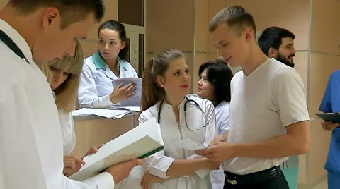 Group doctors at reception in hospital Stock Footage 59955432