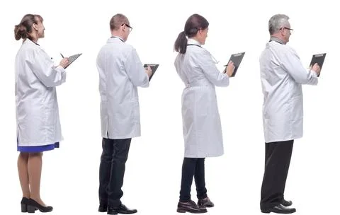 Group of doctors standing with their backs isolated on white Stock Photos