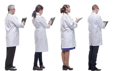Group of doctors standing with their backs isolated on white Stock Photos