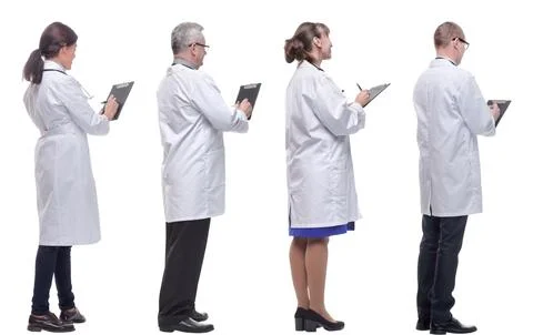 Group of doctors standing with their backs isolated on white 스톡 사진