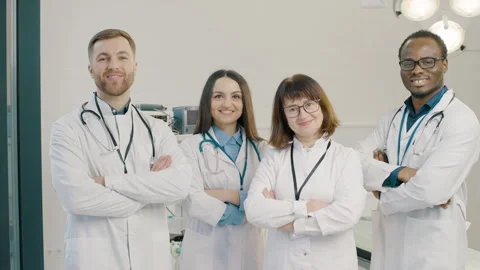 Group of doctors standing together after a successful surgery Stock Footage 265256506