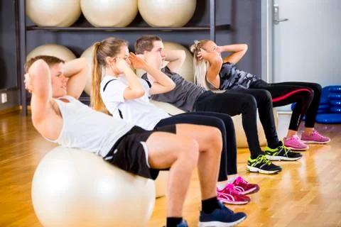 Group does abdominal exercises for core strength Stock Photos