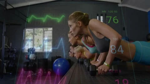 Group doing dumbbell pushups in sync for fitness while camera pulling back Stock Footage 334311954