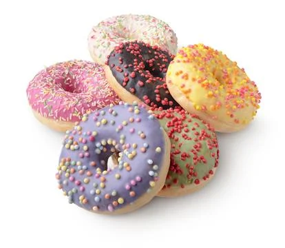 Group of donuts decorated with icing of various colors and colorful sprinkles Stock Photos