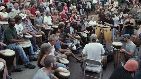 Group of drummers performing together at Drum circle in Asheville, NC Stock Footage 103424159