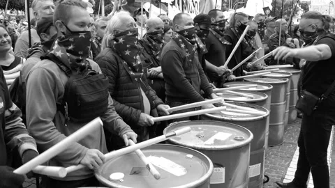 A group of drummers performs drumming, a fraction of the drums - at a picket. Stock Footage 134635812