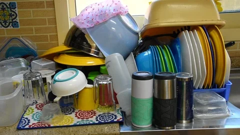 A group of drying dishes piled high in a residential home. Stock Footage 121105926