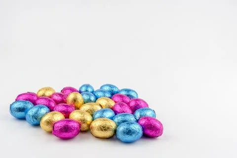 Group of easter eggs in blue, yellow and pink Stock Photos