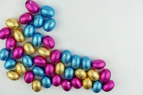 Group of easter eggs in blue, yellow and pink Stock Photos