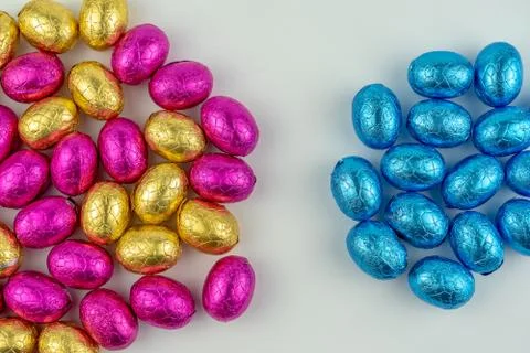 Group of easter eggs in blue, yellow and pink Stock Photos