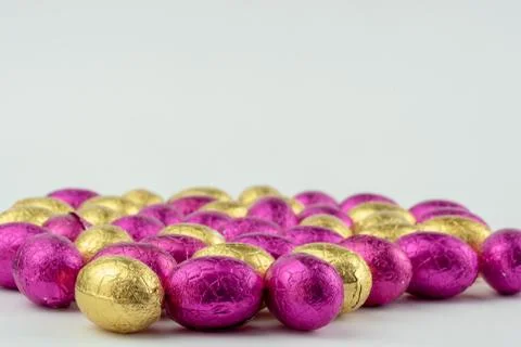 Group of easter eggs in blue, yellow and pink Stock Photos