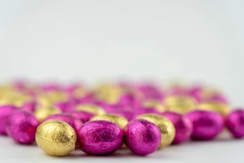 Group of easter eggs in blue, yellow and pink Stock Photos