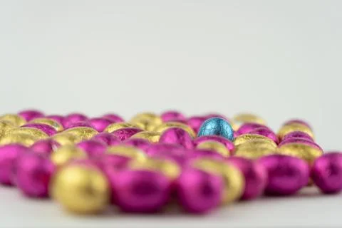 Group of easter eggs in blue, yellow and pink Stock Photos
