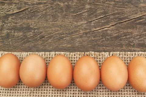 Group of Easter eggs on sackcloth, for frames and labels. Stock Photos