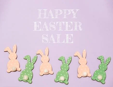 Group of Easter rabbits are on a purple background with the words Foto stock