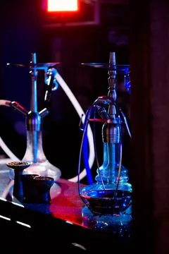 Group of eastern hookahs on table of a bar. Stock Photos