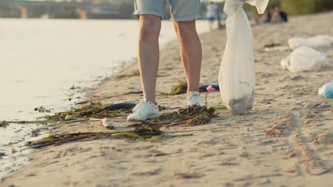 Group of eco-activist cleans garbage in nature. Close-up of a young people Stock Footage 246811067