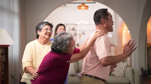 A group of elderly Asian people dance together happily, Stock Footage 252450089