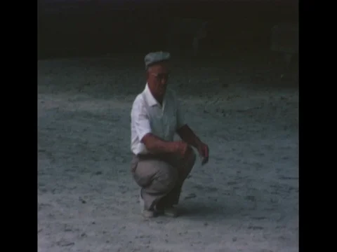 Group of elderly French men playing lawn bowling/ pétanque/ jeu de boules 動画素材 76583638
