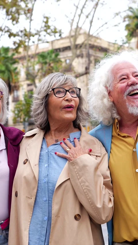 Group of elderly friends enjoying vacation together outdoors Stock Footage 321733324