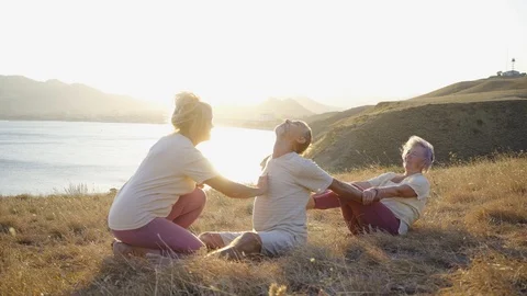 Group of elderly people doing yoga at nature 스톡 동영상 123076122