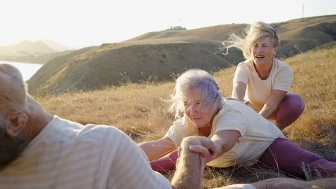 Group of elderly people doing yoga at nature 스톡 동영상 123076837