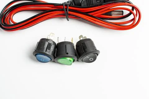 A group of electrical buttons and a bundle of wires Stock Photos