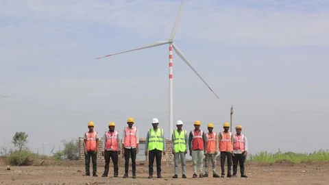 Group of electrical engineers and technicians posing in a row at a remote wind Stock Footage 337206011