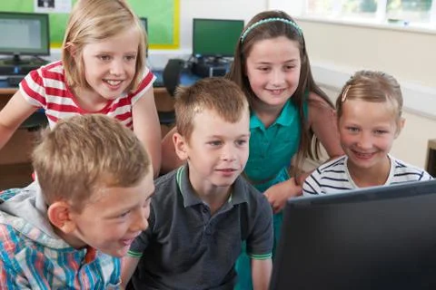 Group Of Elementary Pupils In Computer Class Stock Photos