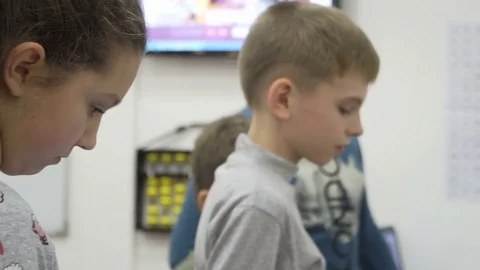Group of elementary school children in classroom at lesson Stock Footage 82444171