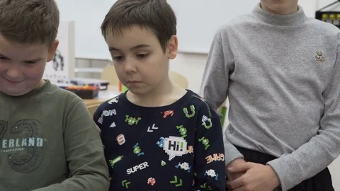 Group of elementary school children in classroom at lesson Stock Footage 82444308