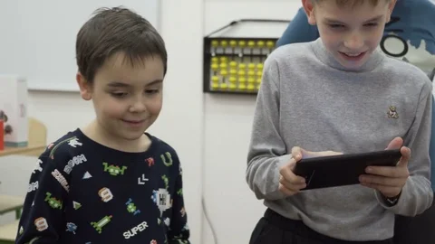 Group of elementary school children in classroom at lesson Stock Footage 82444570