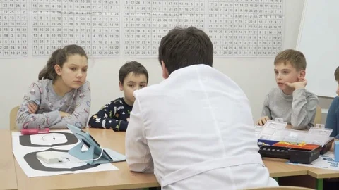 Group of elementary school children in classroom at lesson Stock Footage 82444865