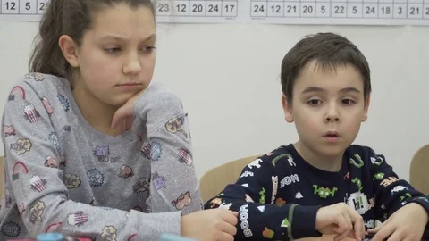 Group of elementary school children in classroom at lesson Stock Footage 82444923