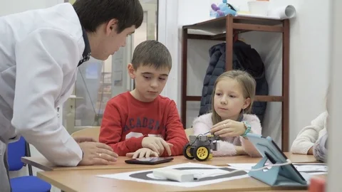 Group of elementary school children in classroom at lesson Stock Footage 82446265