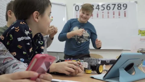 Group of elementary school children in classroom at lesson Stock Footage 82446385