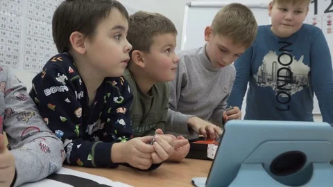 Group of elementary school children in classroom at lesson Stock Footage 82446490
