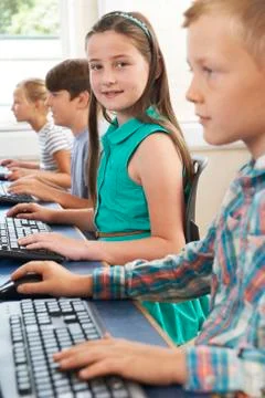Group of elementary school children in computer class Stock Photos