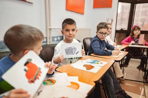 Group of elementary students learning together at language school Stock Photos