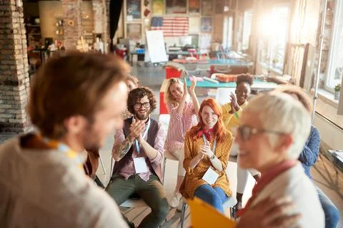 Group of employees clapping hands, congratulate  to colleagues on a great pre Stock Photos