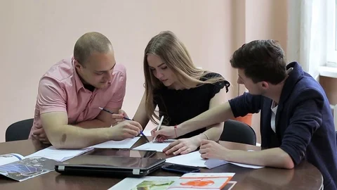 A group of employees work together on the project. Stock Footage 75816980