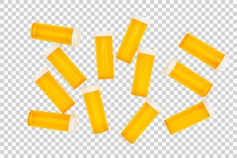 Group of empty amber pill bottles scattered isolated on transparent PNG Stock Photos