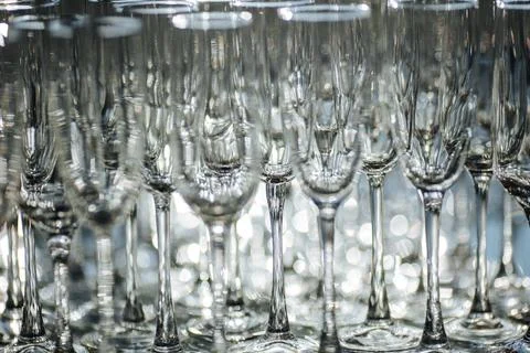 Group of empty and transparent champagne glasses in a restaurant. Stock-Fotos