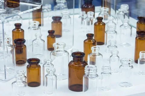 Group of empty clear and brown glass medicine bottles, low-grip Stock Photos