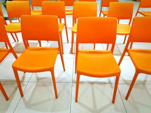 Group of Empty Orange Plastic at Conference Stock-Fotos